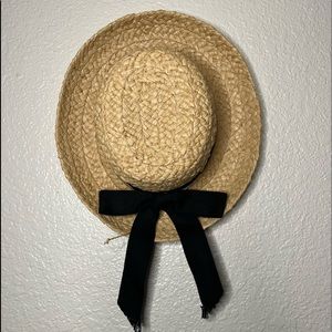 straw hat with black bow